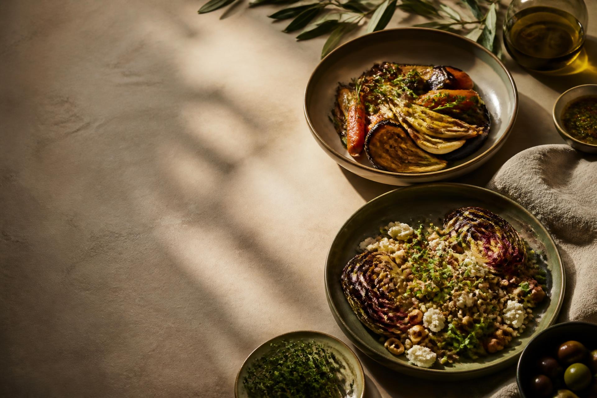 A plant-based meal styled on a warm linen table
